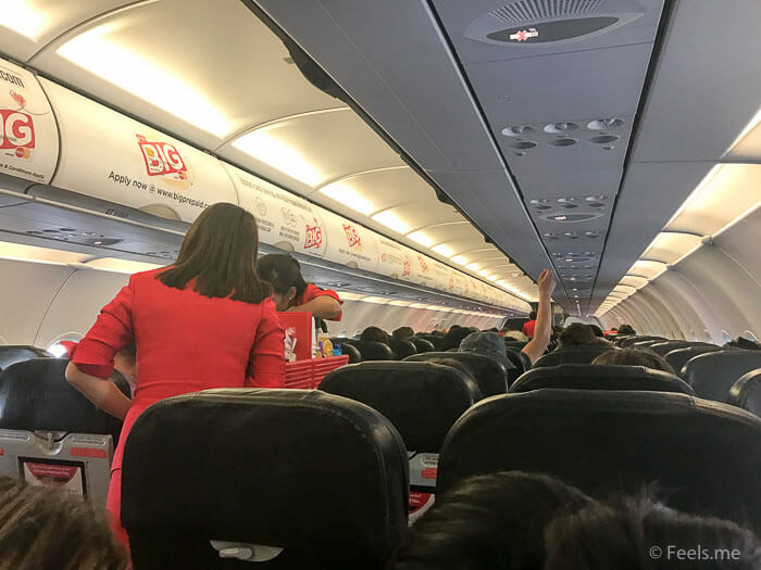 Air Asia SIN BKI Review Busy flight attendant